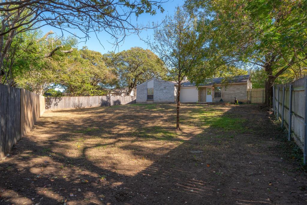 3604 Biscay Drive Arlington, TX 76016 - Photo 18 of 18 a backyard of a house with lots of green space