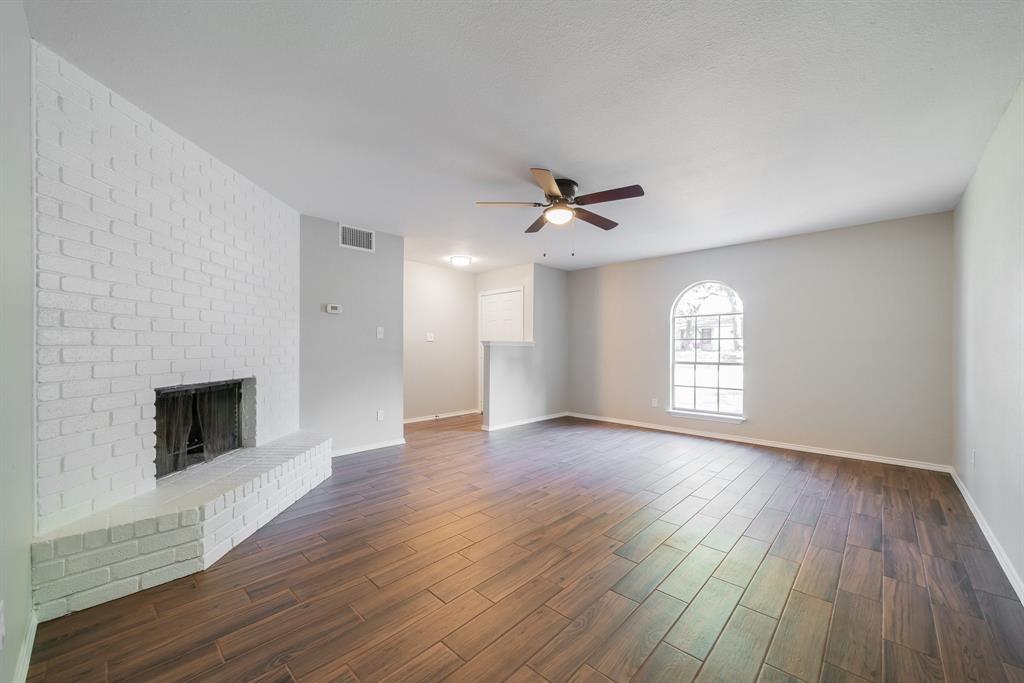 3604 Biscay Drive Arlington, TX 76016 - Photo 2 of 18 wooden floor in an empty room with a window