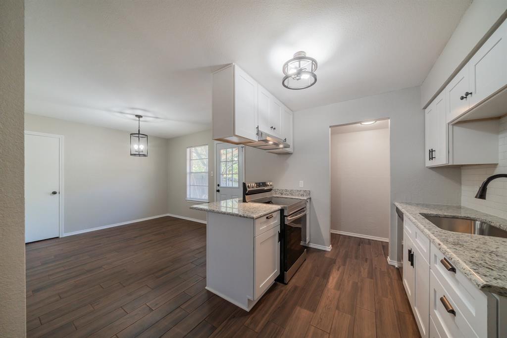 3604 Biscay Drive Arlington, TX 76016 - Photo 5 of 18 a kitchen with a stove and a sink