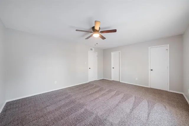 a view of a big room with carpet