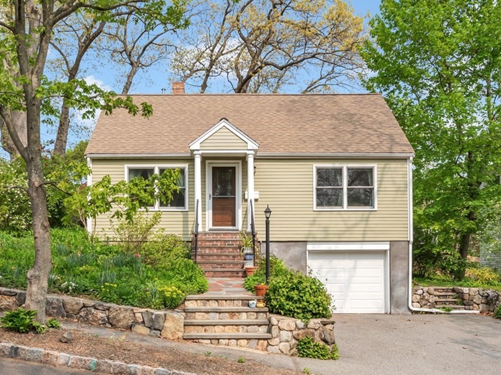 5 Grandview Road Arlington, MA 02476 - Photo 1 of 42 a front view of a house with a yard and garage