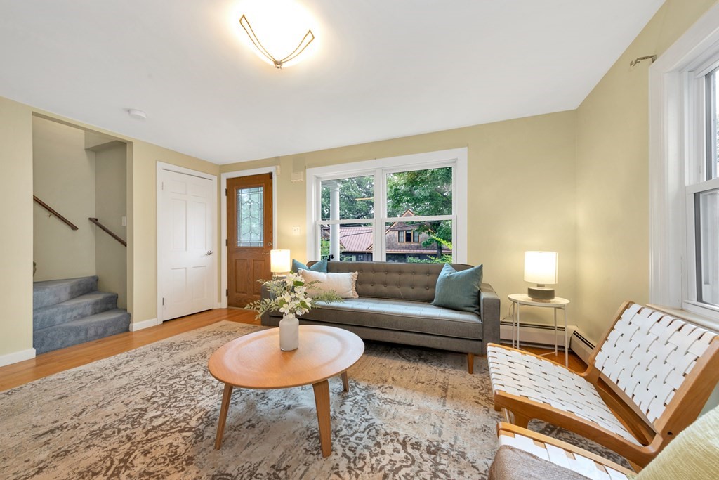 5 Grandview Road Arlington, MA 02476 - Photo 13 of 42 a living room with furniture and a wooden floor