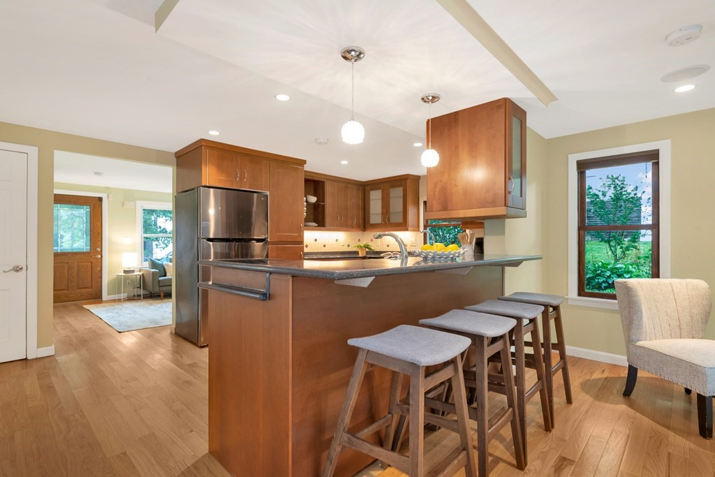 5 Grandview Road Arlington, MA 02476 - Photo 22 of 42 a kitchen with a table and chairs in it