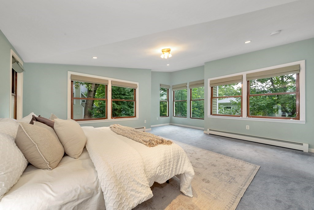 5 Grandview Road Arlington, MA 02476 - Photo 37 of 42 a bed sitting in a spacious bedroom next to a window
