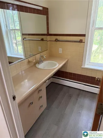 a bathroom with a sink and mirror