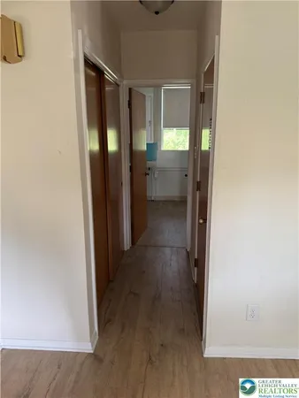 a view of a bathroom from a hallway
