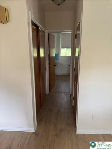 a view of a bathroom from a hallway