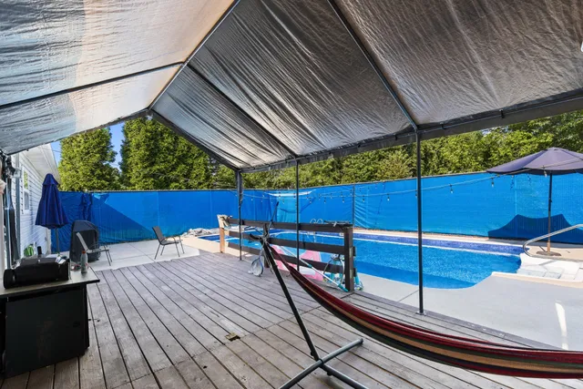 a view of a balcony with chairs