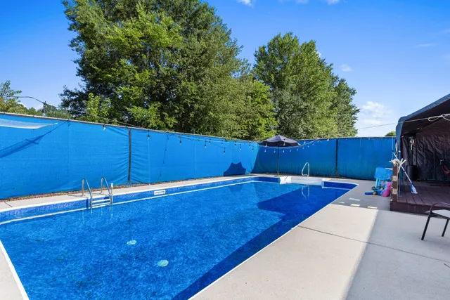 a view of a backyard with furniture