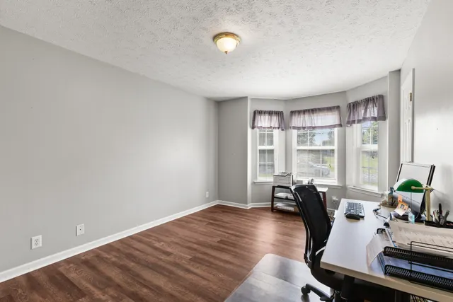 a view of a livingroom with furniture and window