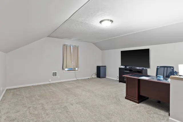 a workspace with furniture and window