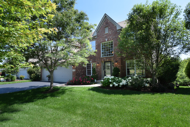 N761 Bartelt Road Geneva, IL 60134 - Photo 1 of 22 a front view of a house with garden