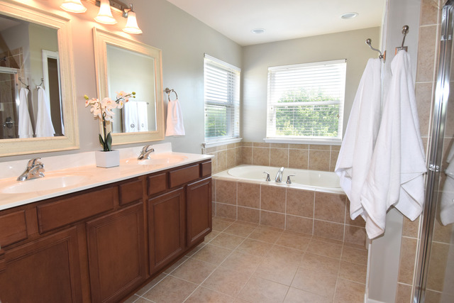 N761 Bartelt Road Geneva, IL 60134 - Photo 13 of 22 a bathroom with a tub sink and mirror
