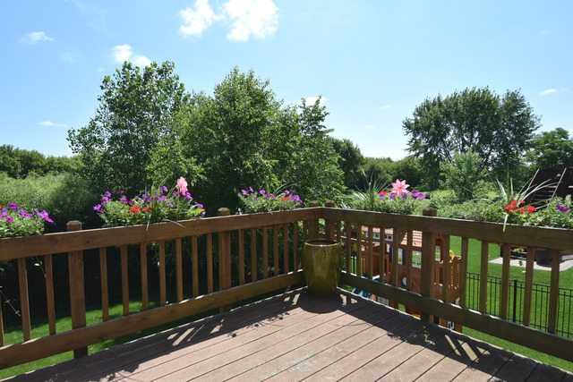 N761 Bartelt Road Geneva, IL 60134 - Photo 20 of 22 a view of wooden deck and flowers