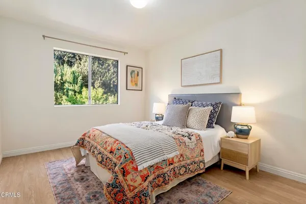 a bedroom with bed and a window