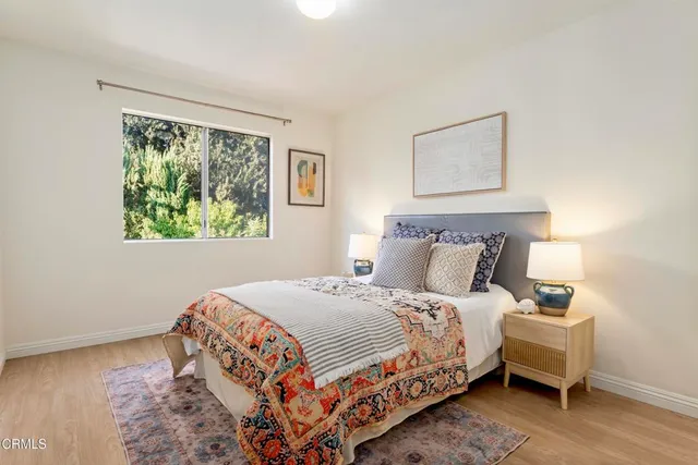 a bedroom with bed and a window