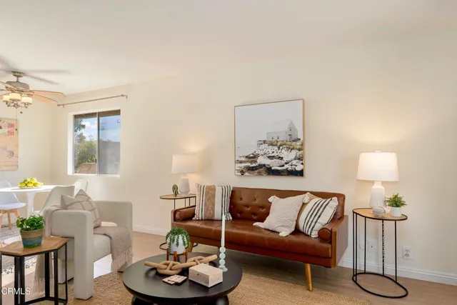 a living room with furniture and a lamp