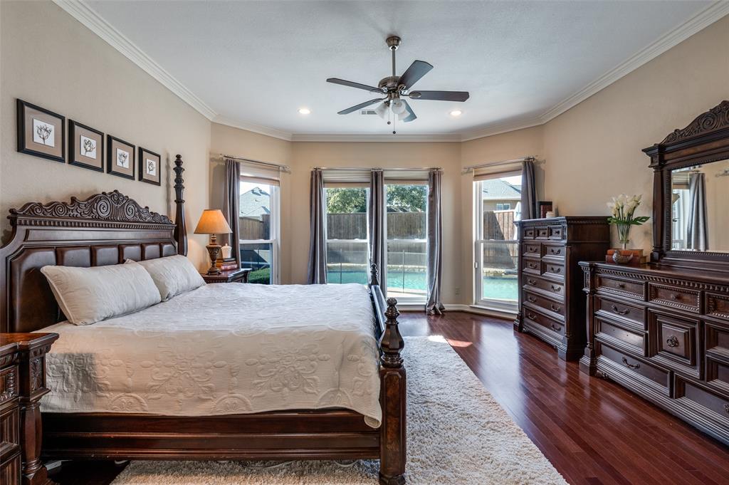 17819 Lost View Road Dallas, TX 75252 - Photo 15 of 39 Master bedroom with wall of windows looking out to pool area