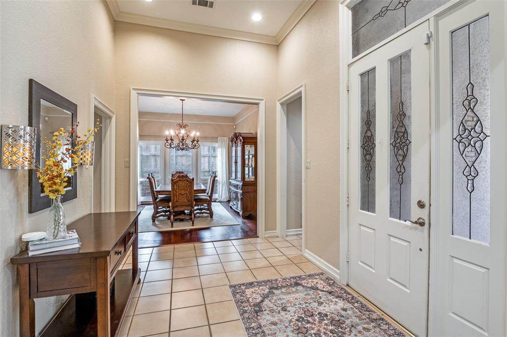 17819 Lost View Road Dallas, TX 75252 - Photo 2 of 39 Entry with soaring ceilings opens to formal dining