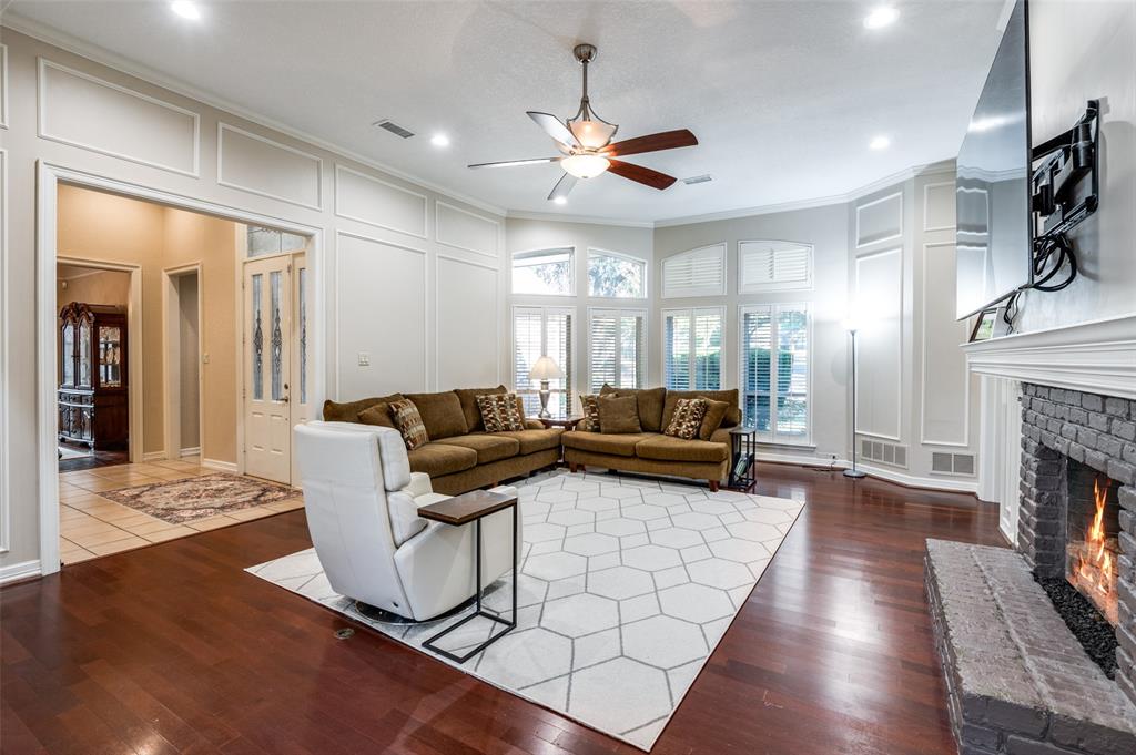 17819 Lost View Road Dallas, TX 75252 - Photo 5 of 39 Living area with wall of windows and gas log fireplace