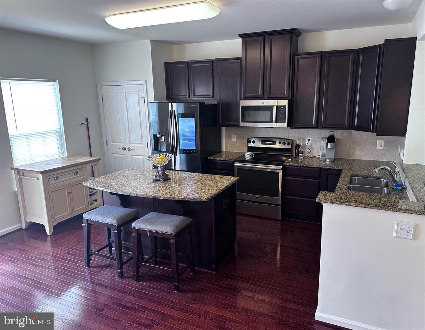 313 Brenton Road, Unit 40 Fredericksburg, VA 22405 - Photo 11 of 18 Modern kitchen with rich cabinetry.