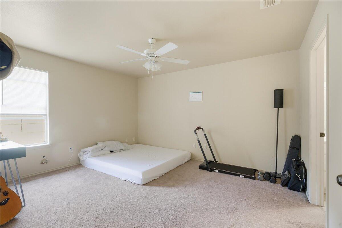3118 113th Street Lubbock, TX 79423 - Photo 18 of 21 a room with a bed and a window