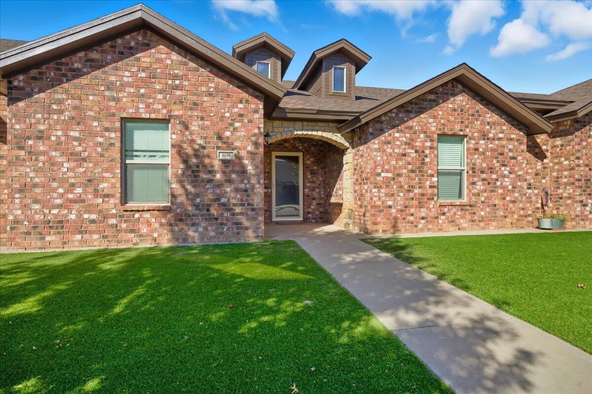 3118 113th Street Lubbock, TX 79423 - Photo 2 of 21 a front view of a house with garden