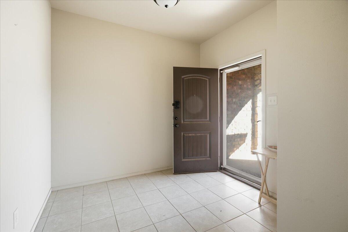 3118 113th Street Lubbock, TX 79423 - Photo 3 of 21 a view of an empty room and window