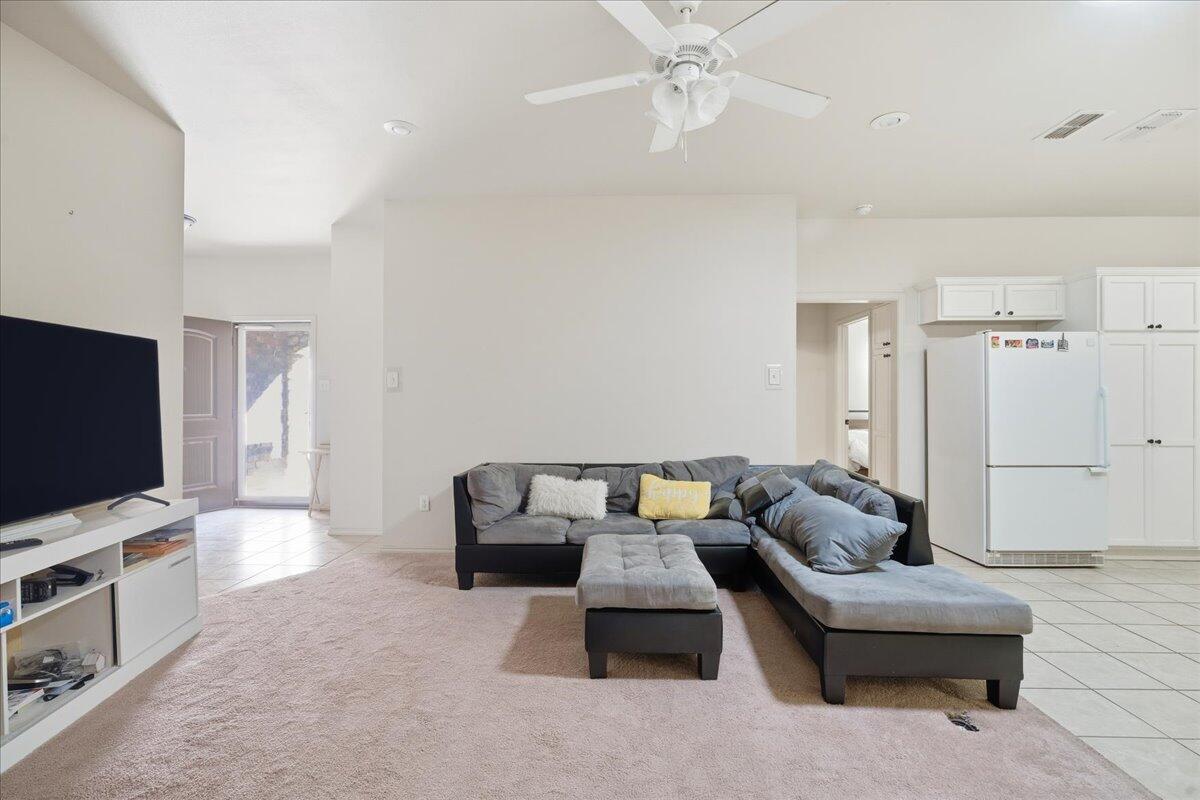3118 113th Street Lubbock, TX 79423 - Photo 5 of 21 a living room with furniture and a flat screen tv