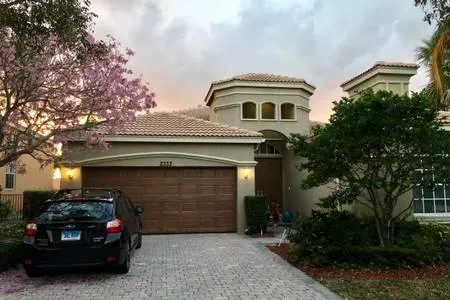 a front view of a house with a garage