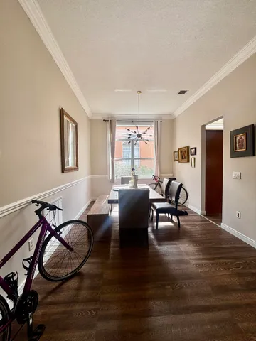 a room with dining table and chairs