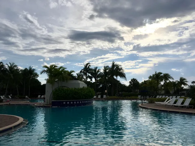 a view of a park that has a street sign
