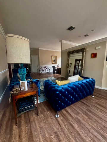 a view of a path along with potted plants