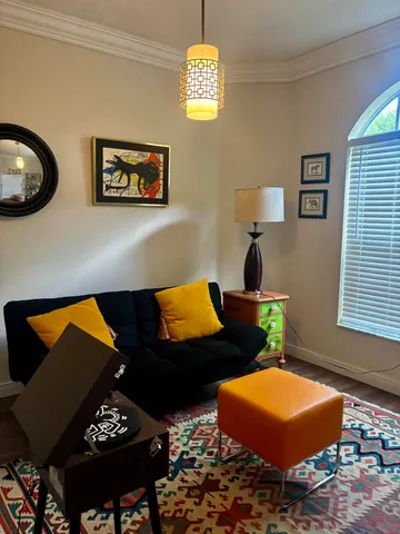 a view of a chair and table in backyard