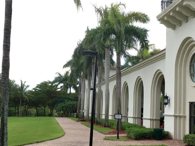 a building with potted plants in front of door