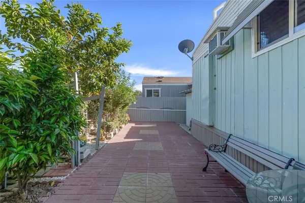 a view of a pathway both side of house