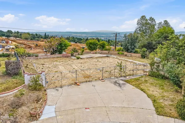a view of a yard and ocean view