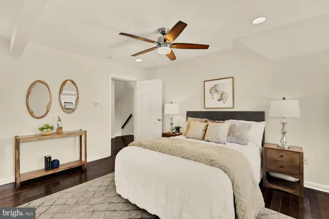 a bed room with a bed and a chandelier