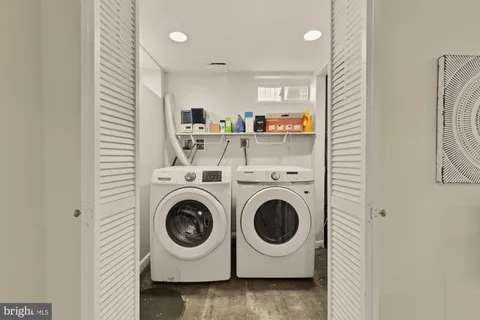 a utility room with dryer and washer