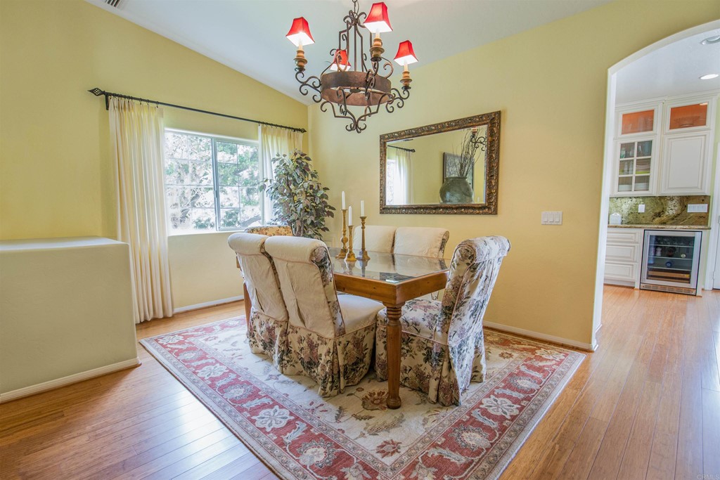 1793 Rocrest Road Alpine, CA 91901 - Photo 24 of 63 a view of a dining room with furniture wooden floor and chandelier