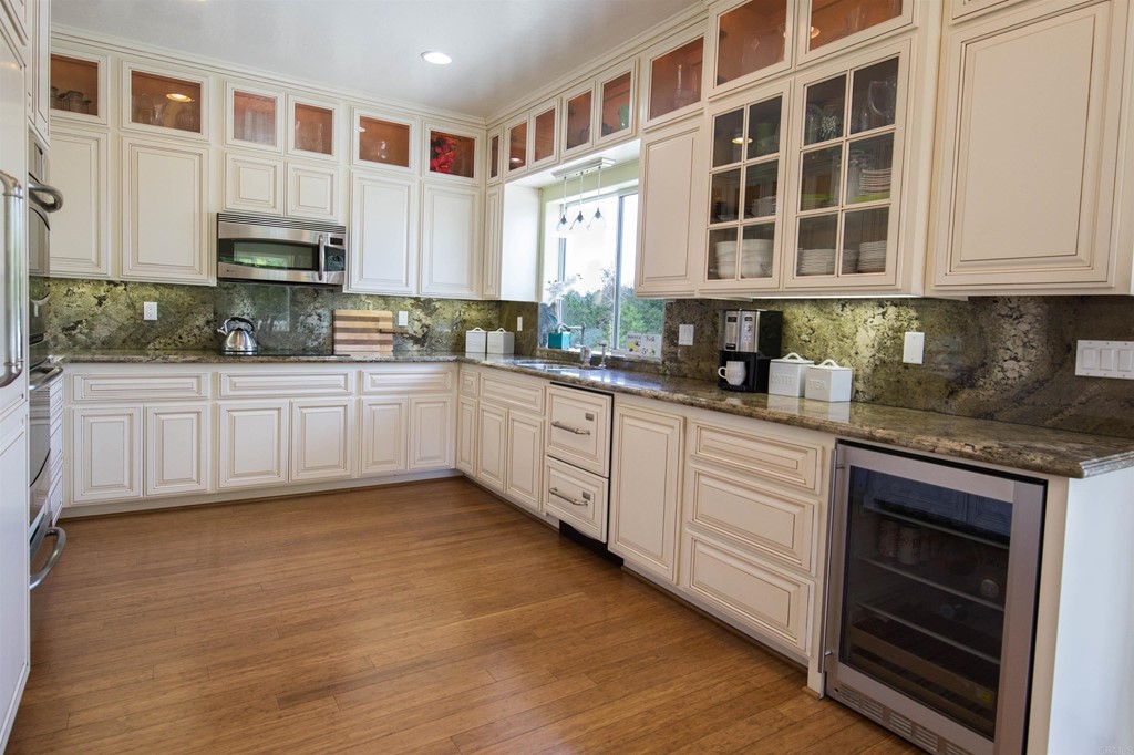 1793 Rocrest Road Alpine, CA 91901 - Photo 25 of 63 a kitchen with stainless steel appliances granite countertop a stove and cabinets