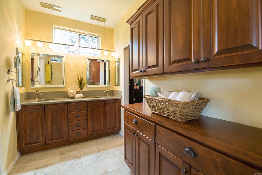 1793 Rocrest Road Alpine, CA 91901 - Photo 31 of 63 a kitchen with a sink and cabinets