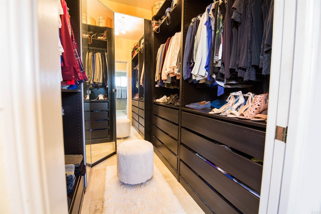 1793 Rocrest Road Alpine, CA 91901 - Photo 34 of 63 a view of walk in closet with clothes and shoes