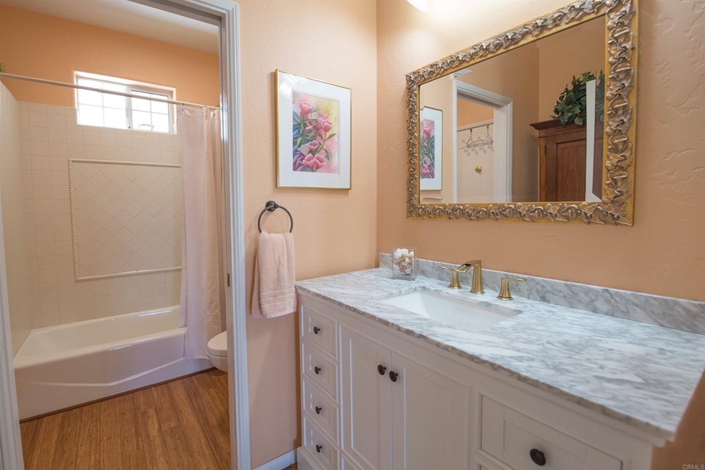 1793 Rocrest Road Alpine, CA 91901 - Photo 36 of 63 a bathroom with a granite countertop sink and a mirror