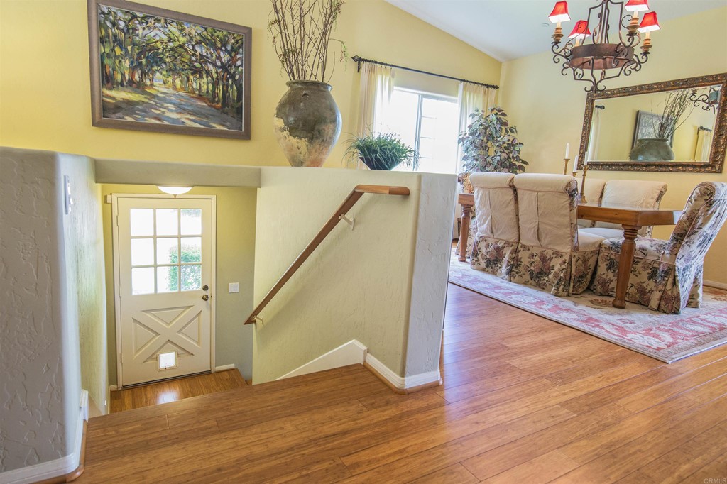 1793 Rocrest Road Alpine, CA 91901 - Photo 37 of 63 a view of a hallway with wooden floor and stairs