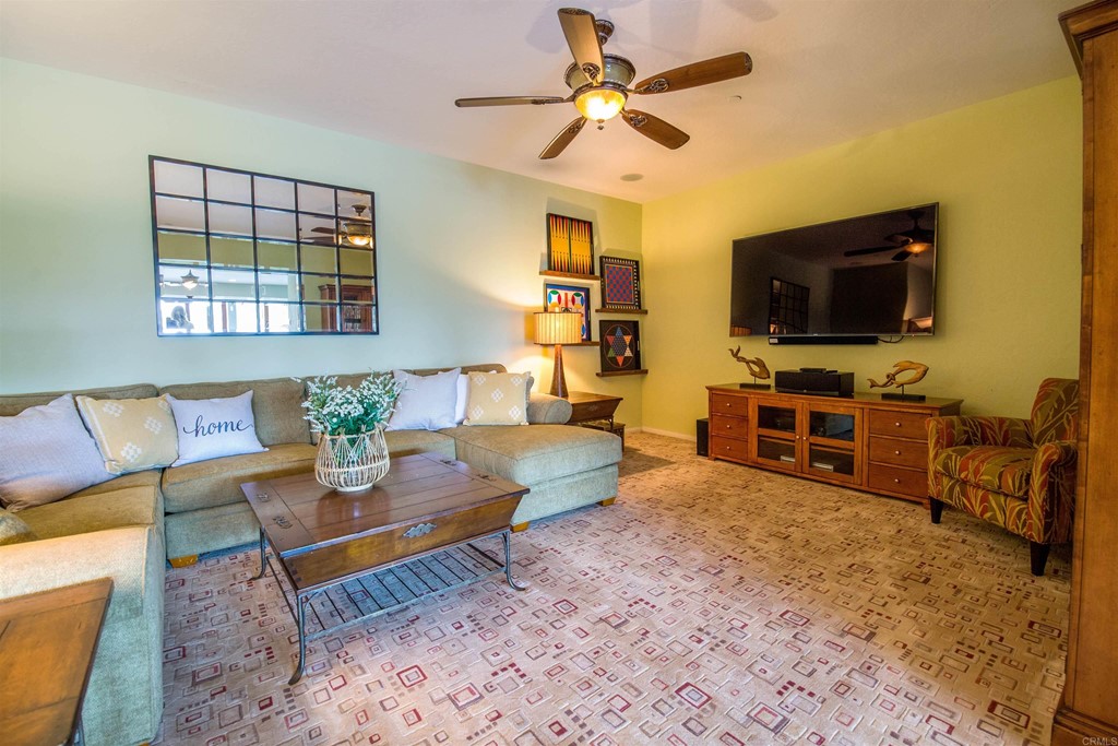 1793 Rocrest Road Alpine, CA 91901 - Photo 46 of 63 a living room with furniture and a flat screen tv
