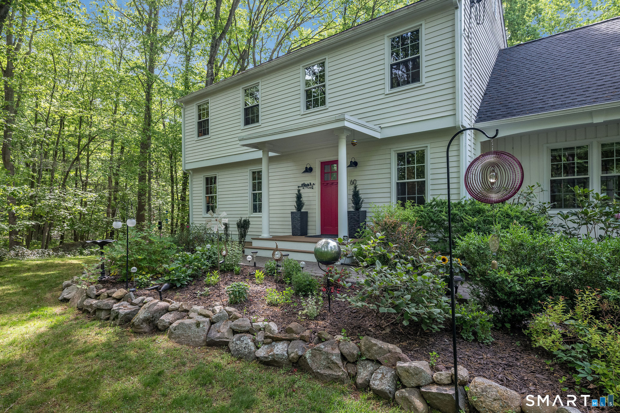60 Bradley Corners Road Madison, CT 06443 - Photo 2 of 33 a front view of a house with garden