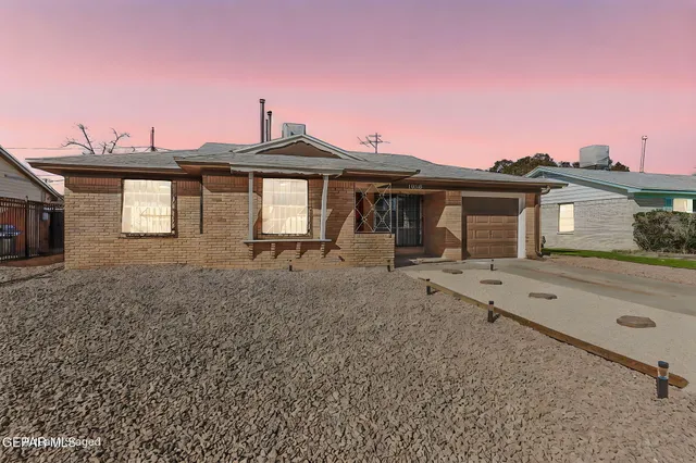 a front view of a house with yard