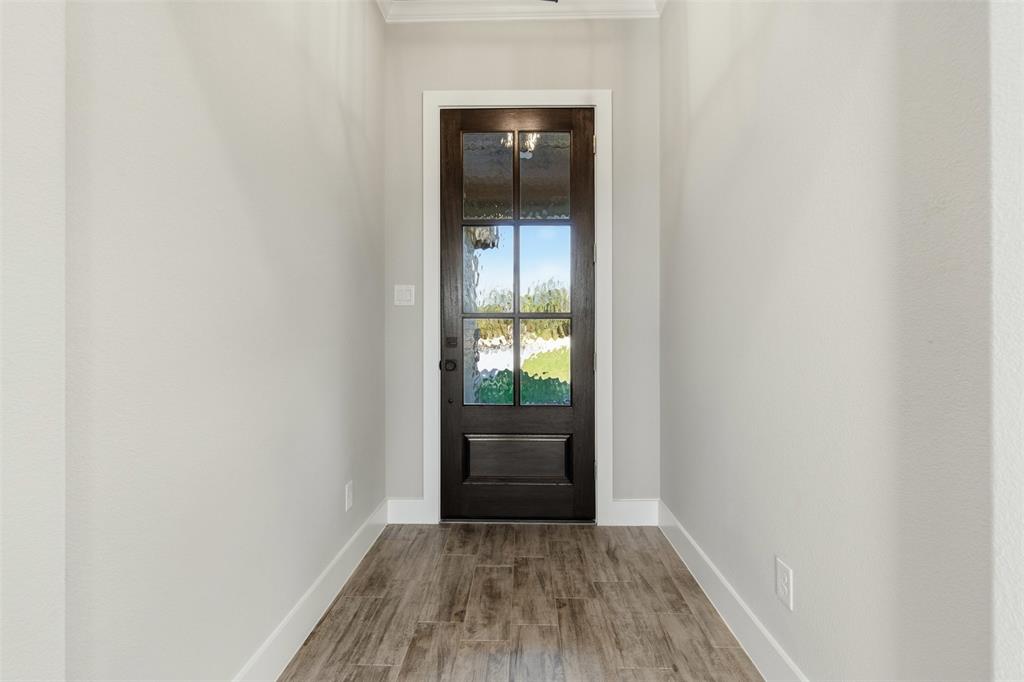 328 Rita Ridge Millsap, TX 76066 - Photo 12 of 27 a view of an empty room with wooden floor and a window