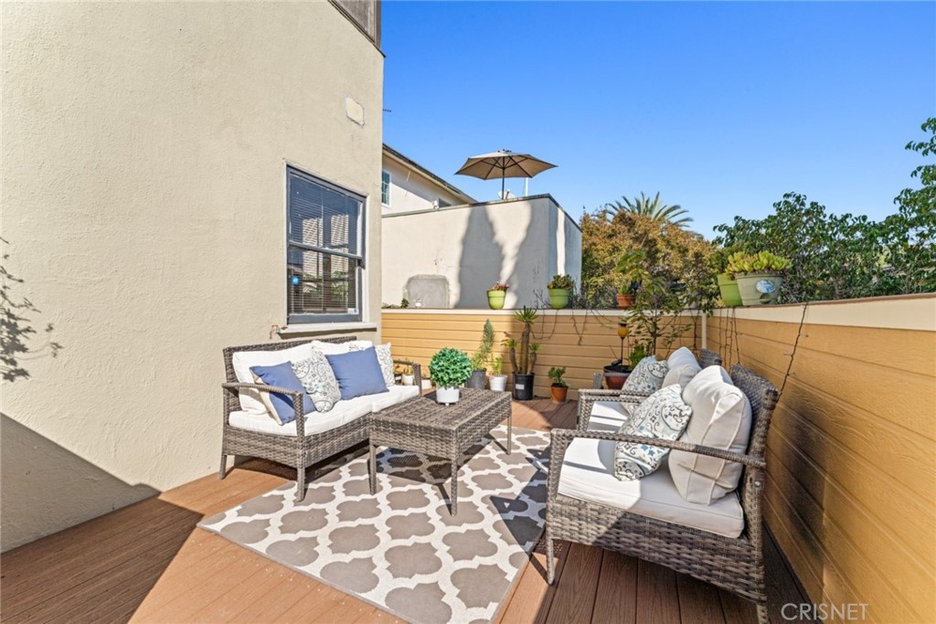 2452 Riverside Place Los Angeles, CA 90039 - Photo 12 of 13 a balcony with chairs and a table